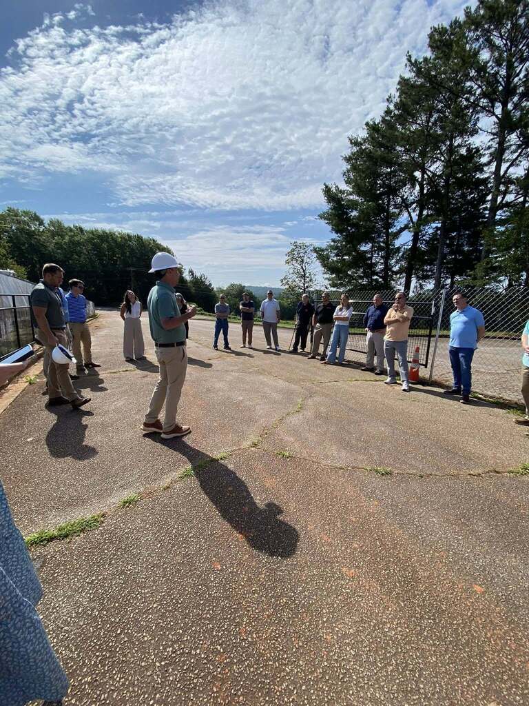 Pastors standing in parking lot at G2i.