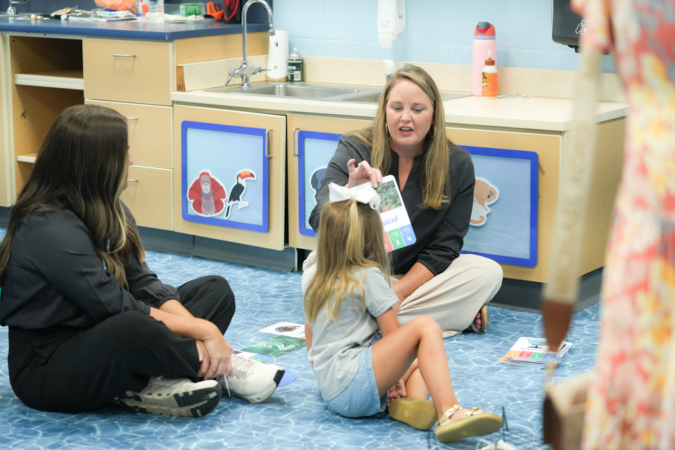 Grand Opening of SDPC Academy for Early Learners: teachers working with student during classroom tour