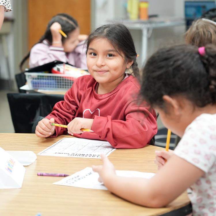 student smiling in class