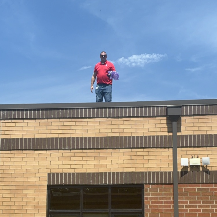 Mr. Shipman helps from the roof
