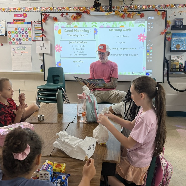 Students in Mrs. McKenzie’s third grade class listening to a special grandparent reader