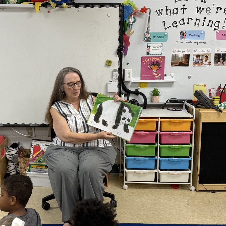 Students in Ms. Lewis’s third grade class listening to a special grandparent reader