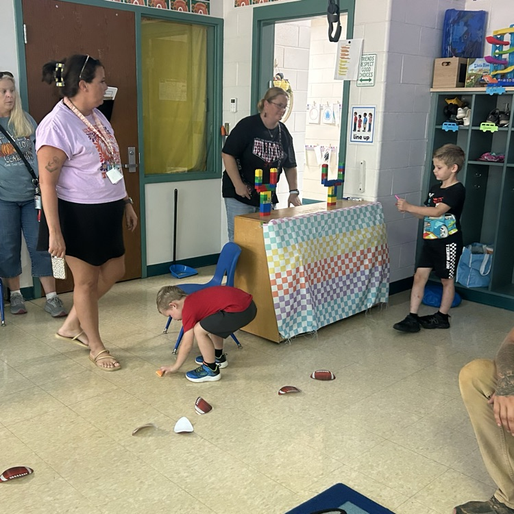 Mrs. Brown had students using gross motor skills to walk the football line. 