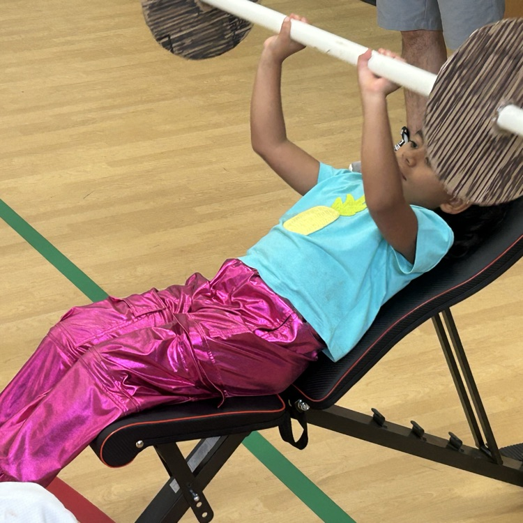 One our little bulldogs lifting weights in the gym