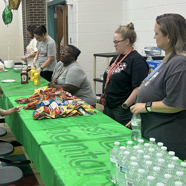 Our East End staff serving hotdogs at family night