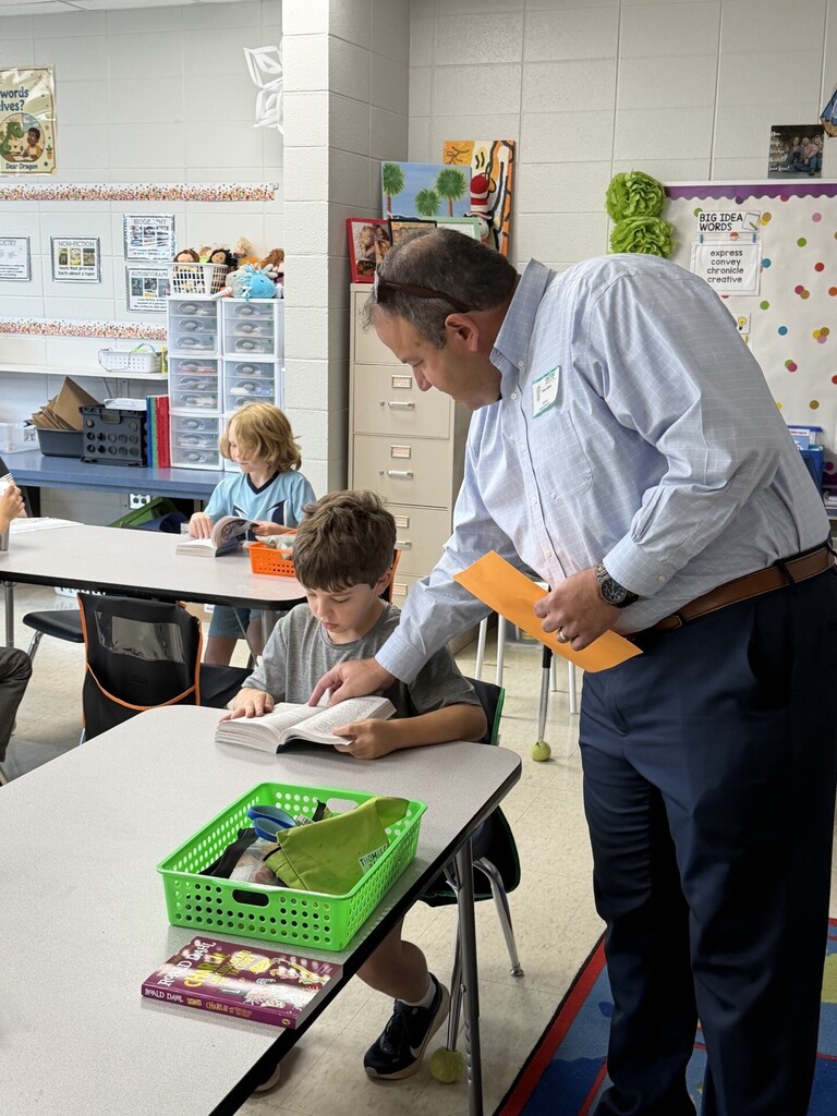 Student getting help looking up a word.