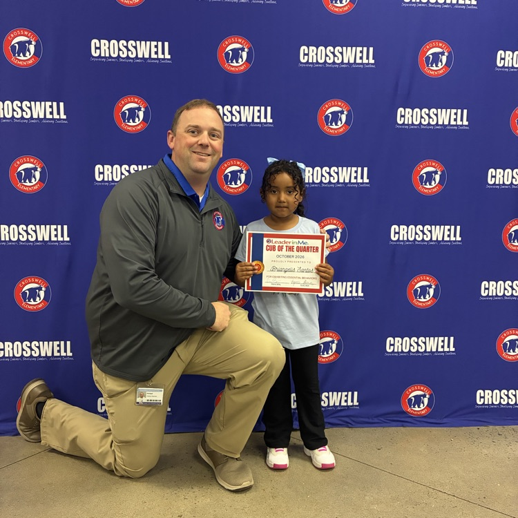 Mr. Shipman poses with a kindergarten