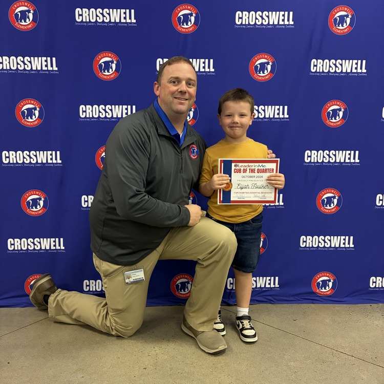 Mr. Shipman poses with a student