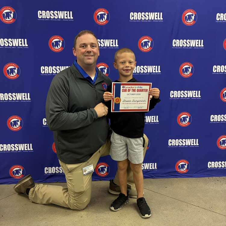 Mr. Shipman poses with a student