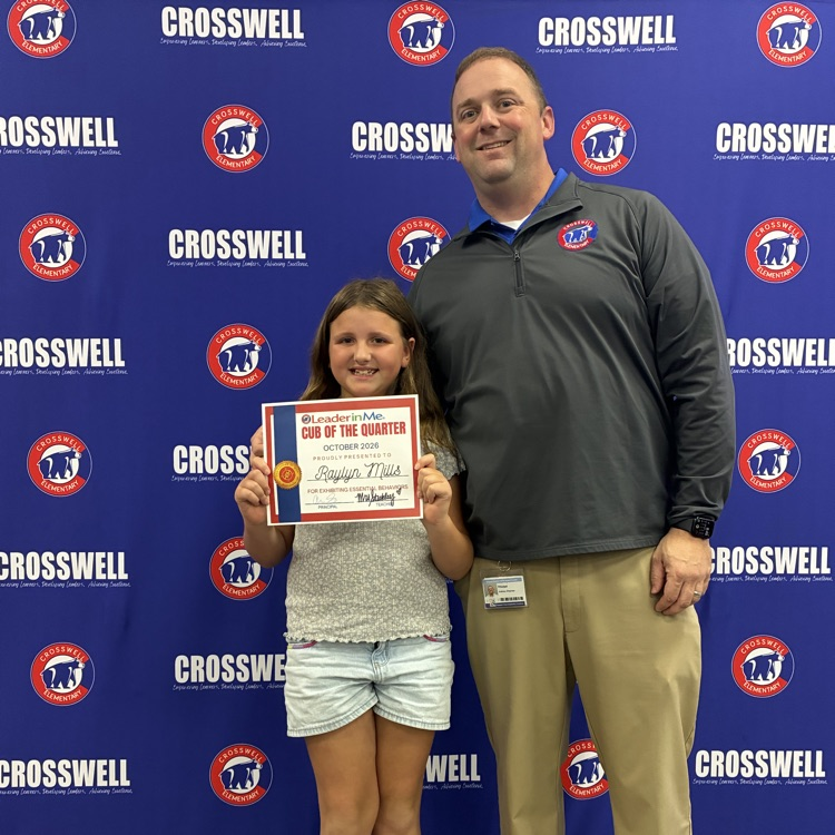 Mr. Shipman poses with a student 