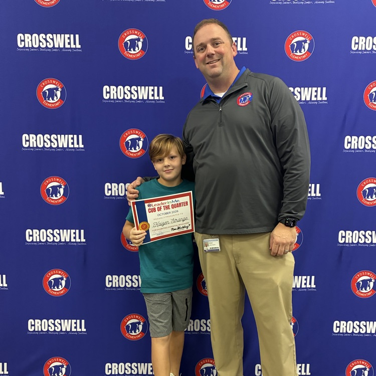 Mr. Shipman poses with students 