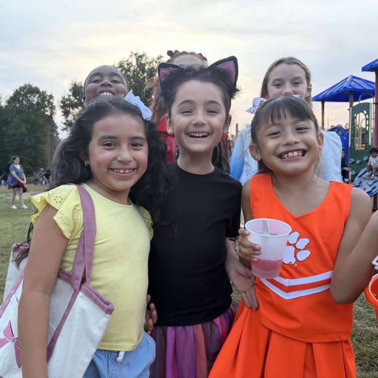 students in costume smile