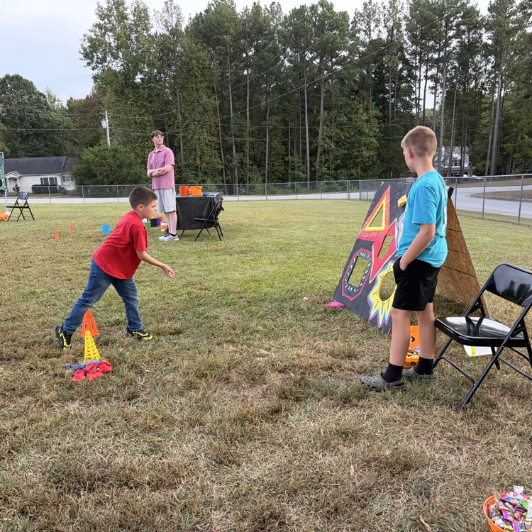 students play games with tickets and candy