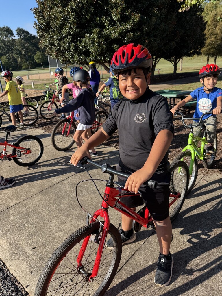 Fourth grade student on a bike.