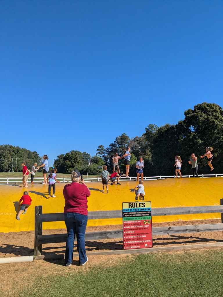 students and teachers bounce at Denver Downs