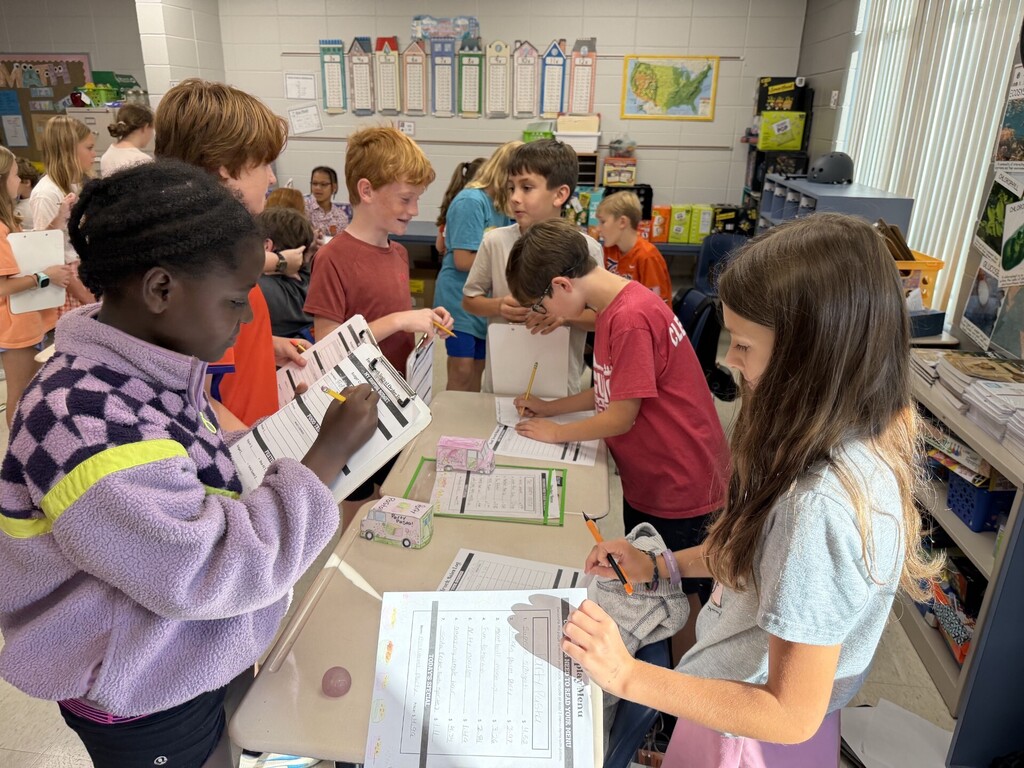 Fifth grade students buying and selling at the Food Truck Festival.