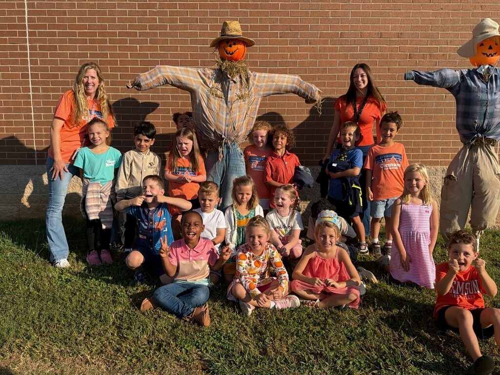 Mrs. Taylor's Kindergarten class with their scarecrow.