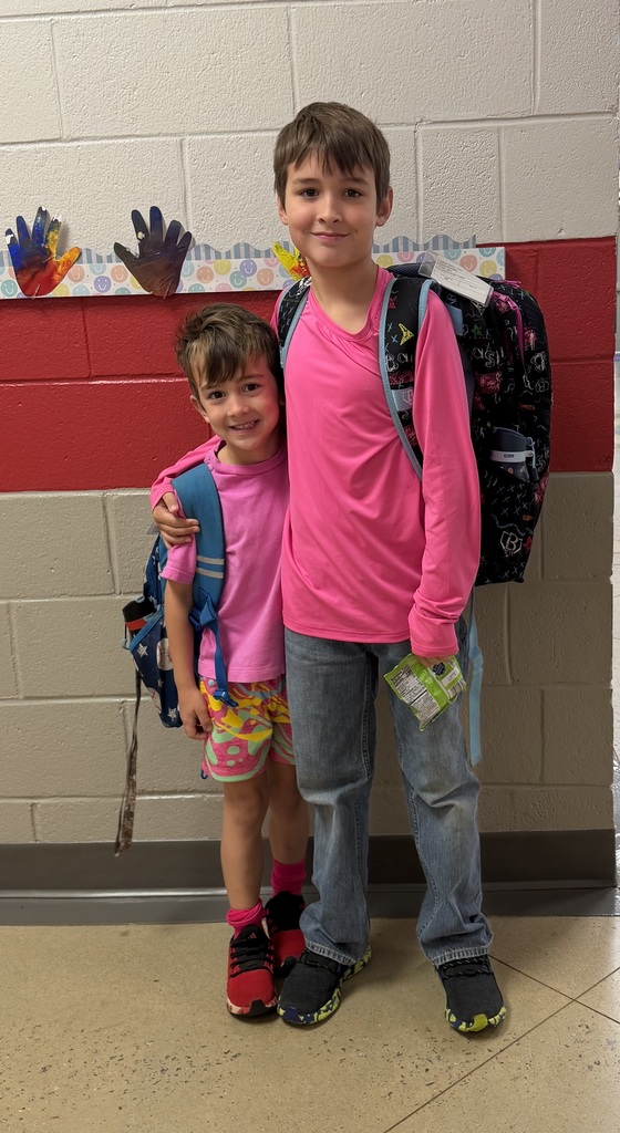 brothers pose in their pink
