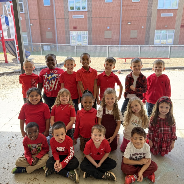 Mrs. Sanders’s class posing in their red on the K playground showing they are all ready for red ribbon week!