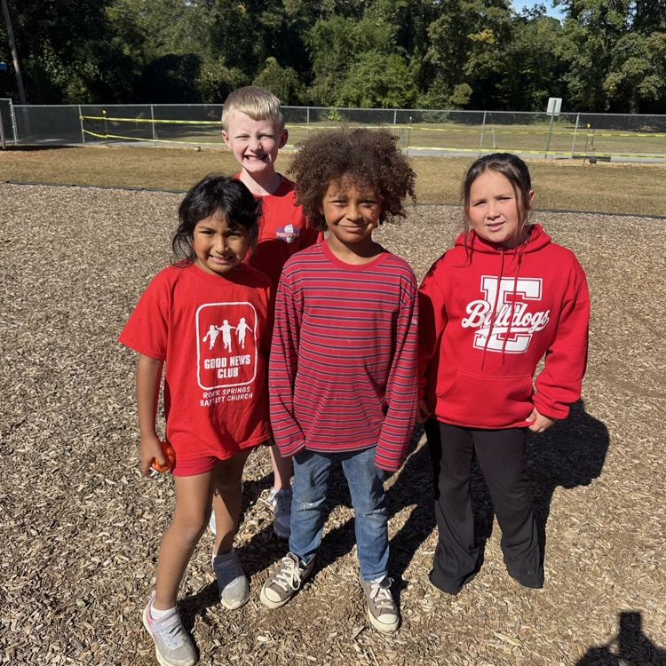 a group of 4th graders showing off their red during red ribbon week