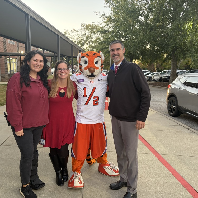 Our leadership team is ready to celebrate Red Ribbon Week and we got a good hug from the Tiger Cub!