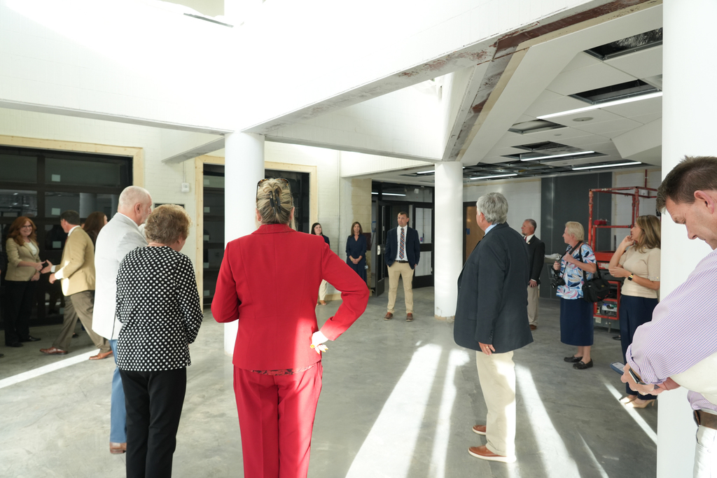 Director Tim Johnson speaking to the group in the lobby of G2i during dedication