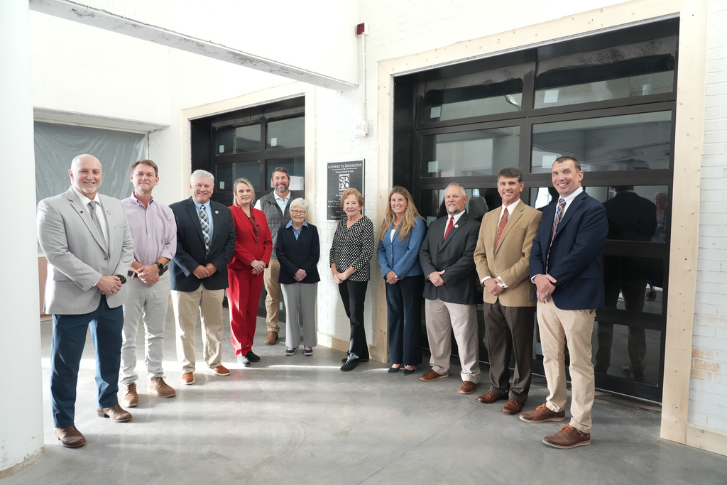 Photo of Board of Trustees members with Dr. Danny Merck, Director Tim Johnson, and representatives from the construction company