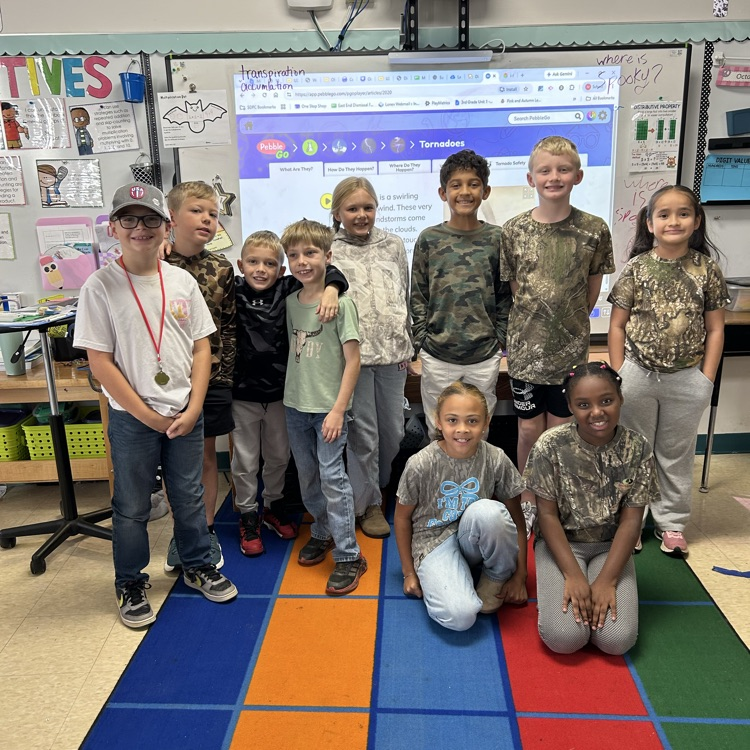 looks like a combo of camo and country in this class as students pose for red ribbon week