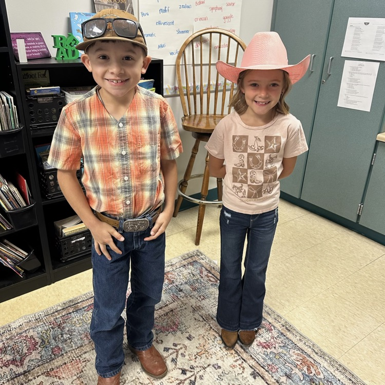 two third grade students dressed in country attire for red ribbon week