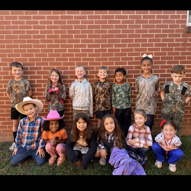 our first graders posing in camo and country  for red ribbon week