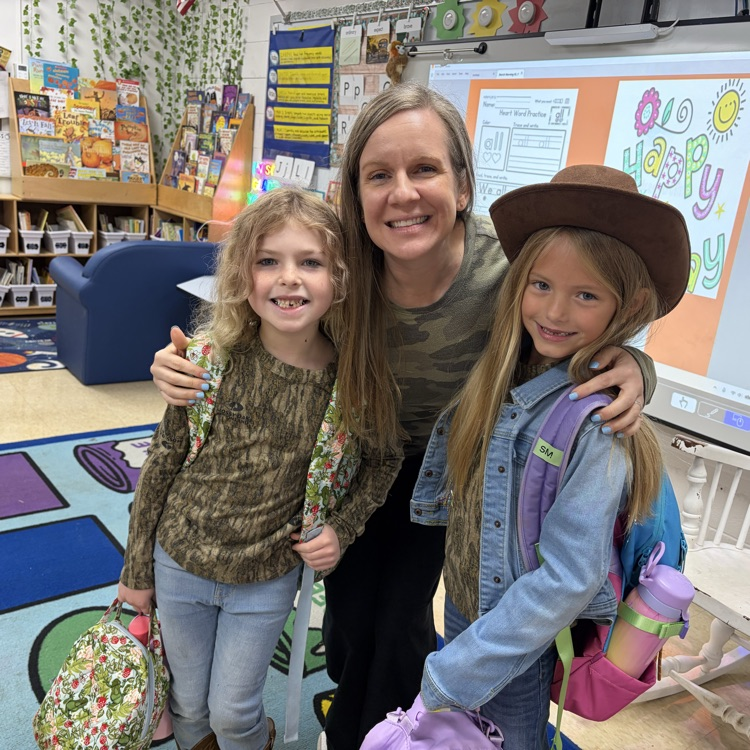 posing with Mrs. Gerhardt for red ribbon week dressed in our camo and country