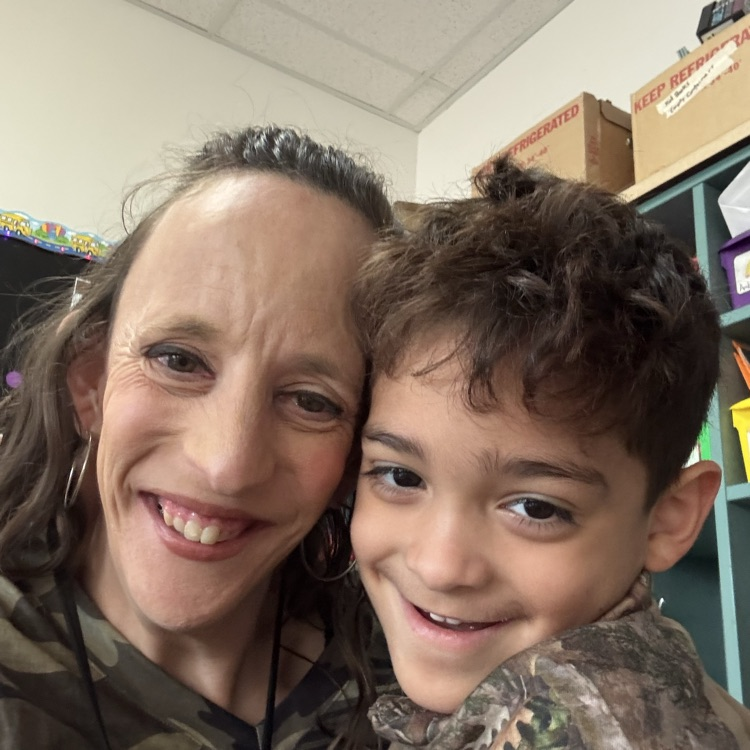 Ms. Young and a k5 student posing in a selfie while wearing camo for red ribbon week