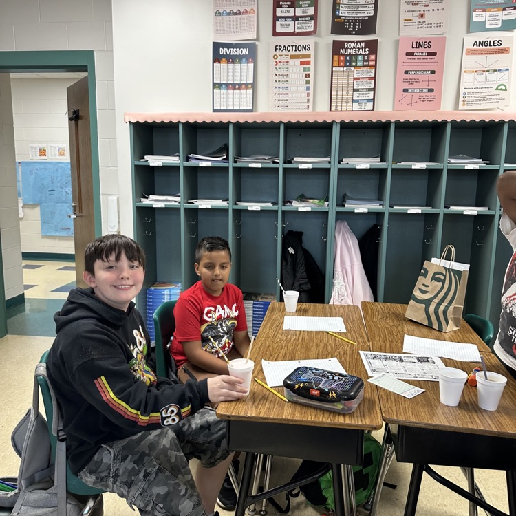 two fifth graders solving the tasks for dirty soda bars