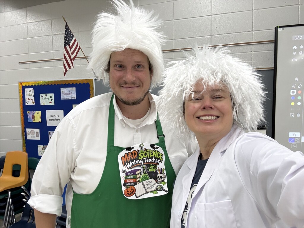 Mad Science teachers looking at owl pellets.