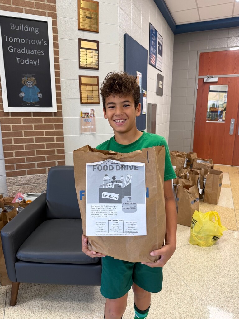 5th grade student loading up collected food.