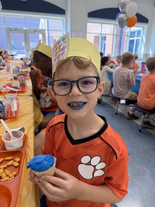 Student eating a cupcake