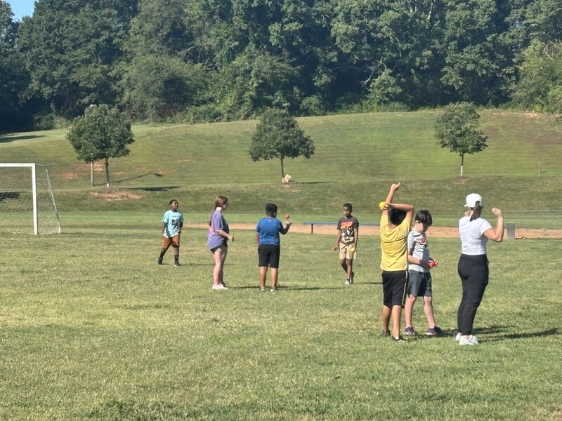 Students in the field participating in the Adaptive Sports Program.