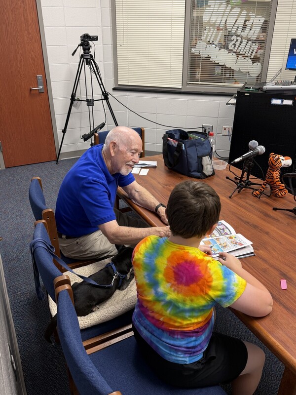 Student reading Dog Man to Dabo