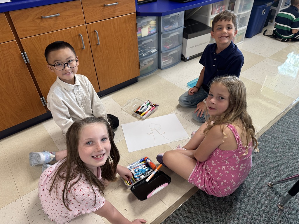 students drawing together