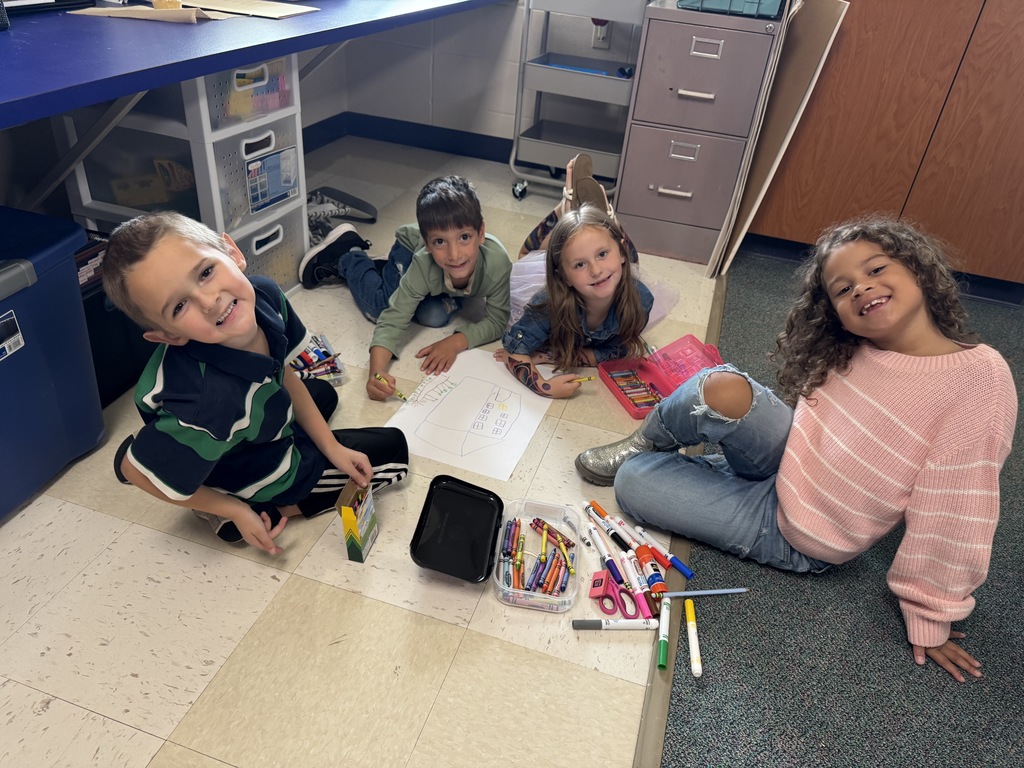 students working together on a drawing