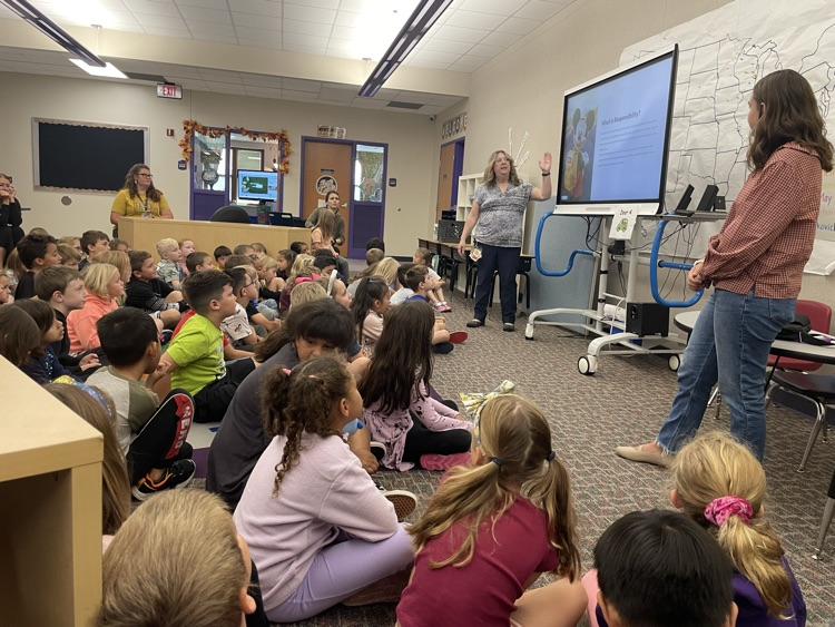 1st graders listening to a counselor during a lesson. 