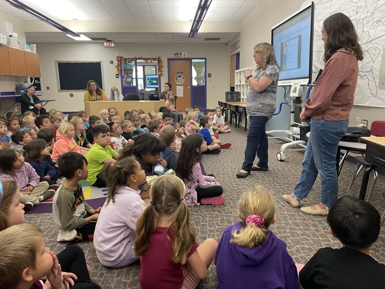 1st graders listening to a counselor during a lesson. 