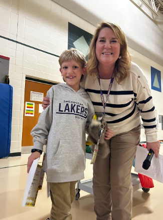 SFES students enjoying the October assembly focused on being responsible. One of the students of the month.