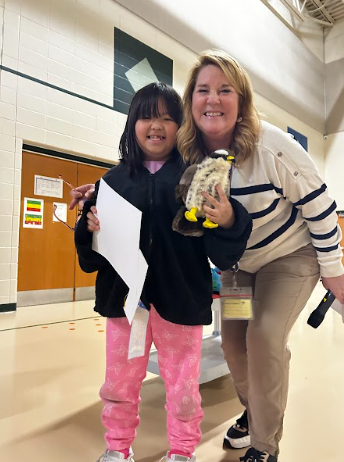 SFES students enjoying the October assembly focused on being responsible. One of the students of the month.