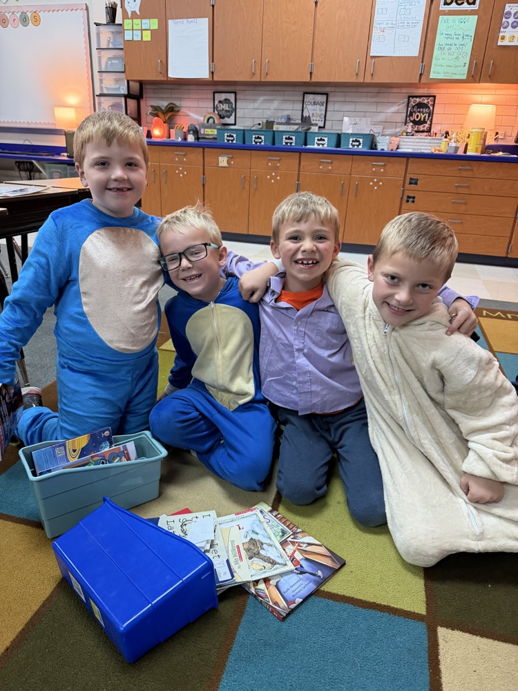 1st graders reading together at the carpet on Halloween 
