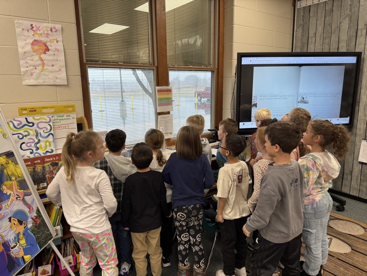 students looking out the window at the 1st snow