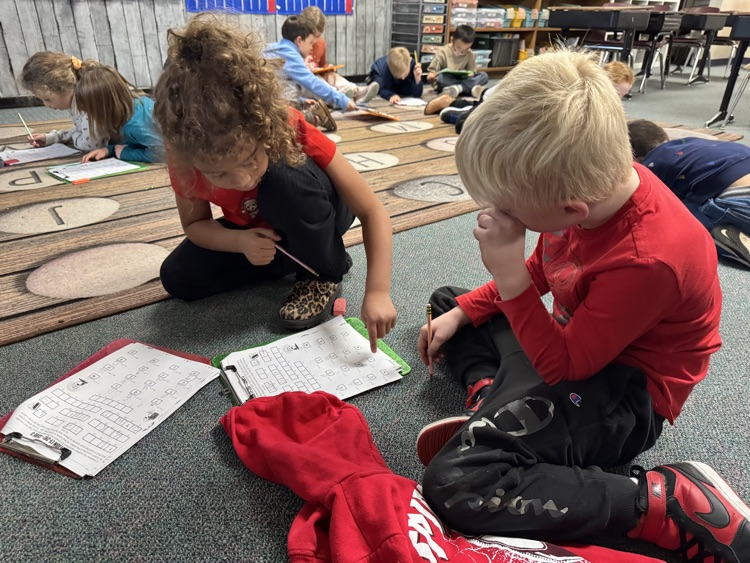 first grade students solving math problems