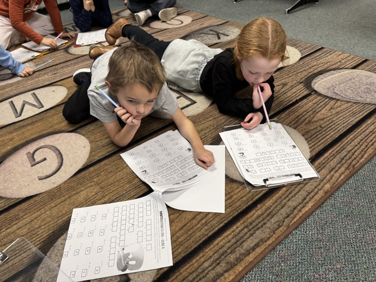 first grade students solving math problems