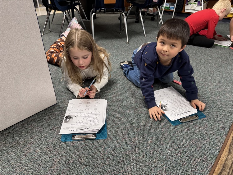 first grade students working together to solve math problems