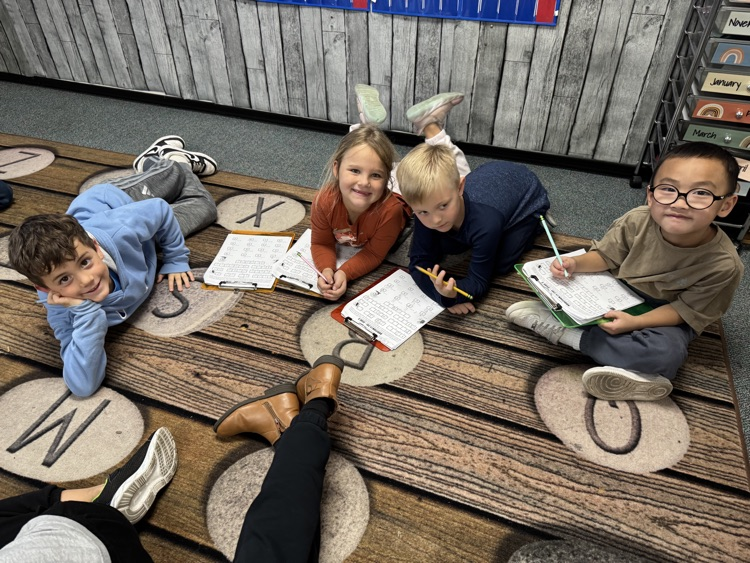 students solving math problems together. 